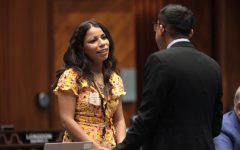 State Representatives Analise Ortiz and Oscar De Los Santos speaking on the floor of the Arizona House of Representatives at the Arizona State Capitol building in Phoenix, Arizona.