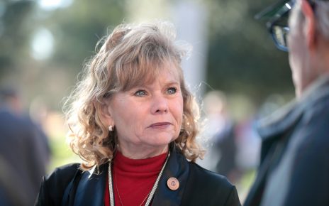 State Senator Christine Marsh speaking with supporters outside the Arizona State Capitol building on the opening day of the 56th Legislature in Phoenix, Arizona.