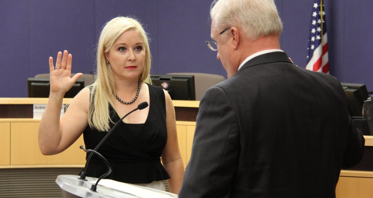 The Honorable Jennifer Ryan-Touhill recites the oath of office at her investiture ceremony in the Board of Supervisors Auditorium in Phoenix, AZ.