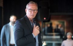 Mesa Mayor John Giles speaking with attendees at a "Yes on 308 Cocktail Hour" event at Cowley Companies in Phoenix, Arizona.